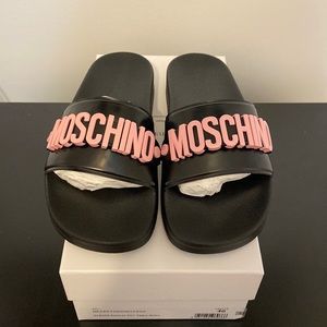 Moschino Womens Raised Logo Leather Pool Slides.